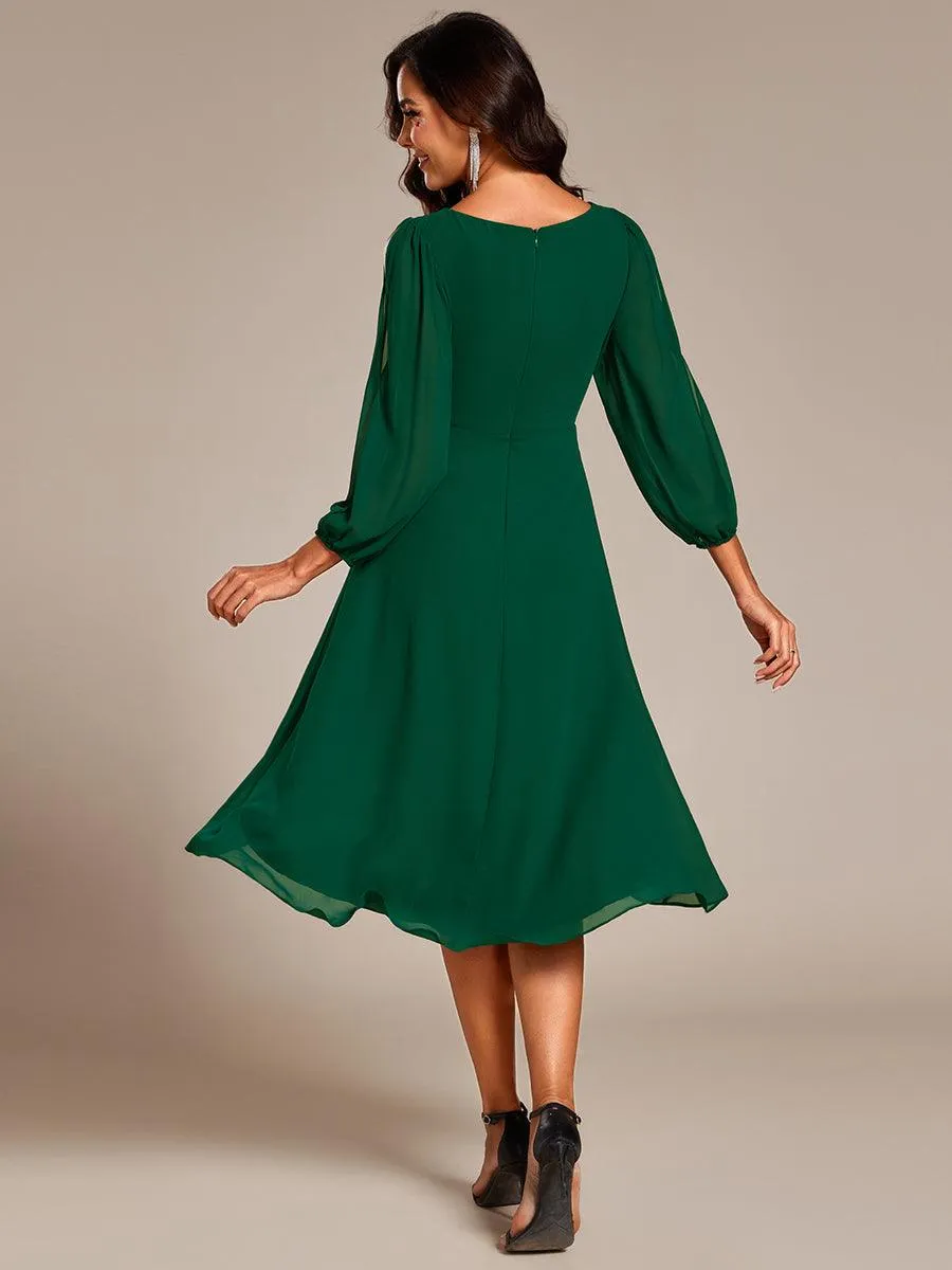 Robe d'invitée de mariage en mousseline de soie à manches longues et taille trapèze