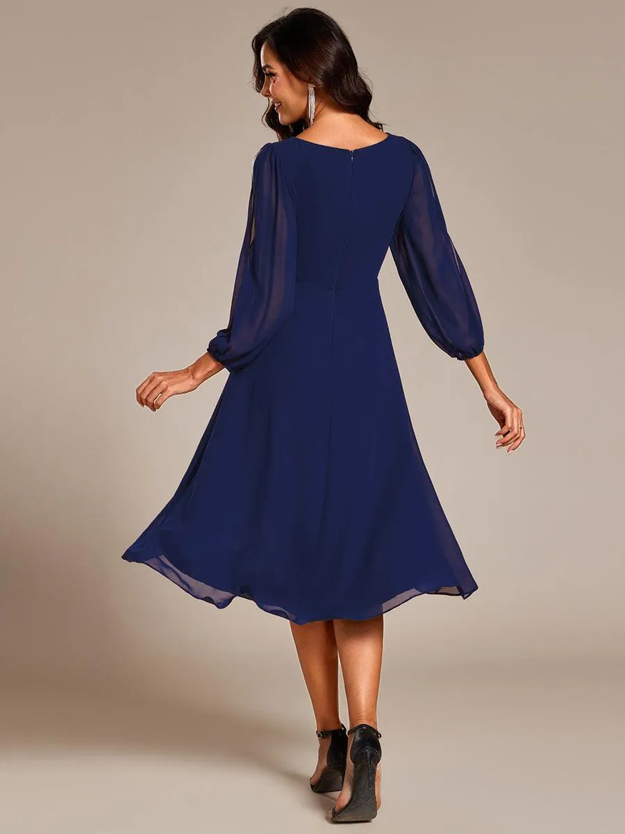 Robe d'invitée de mariage en mousseline de soie à manches longues et taille trapèze