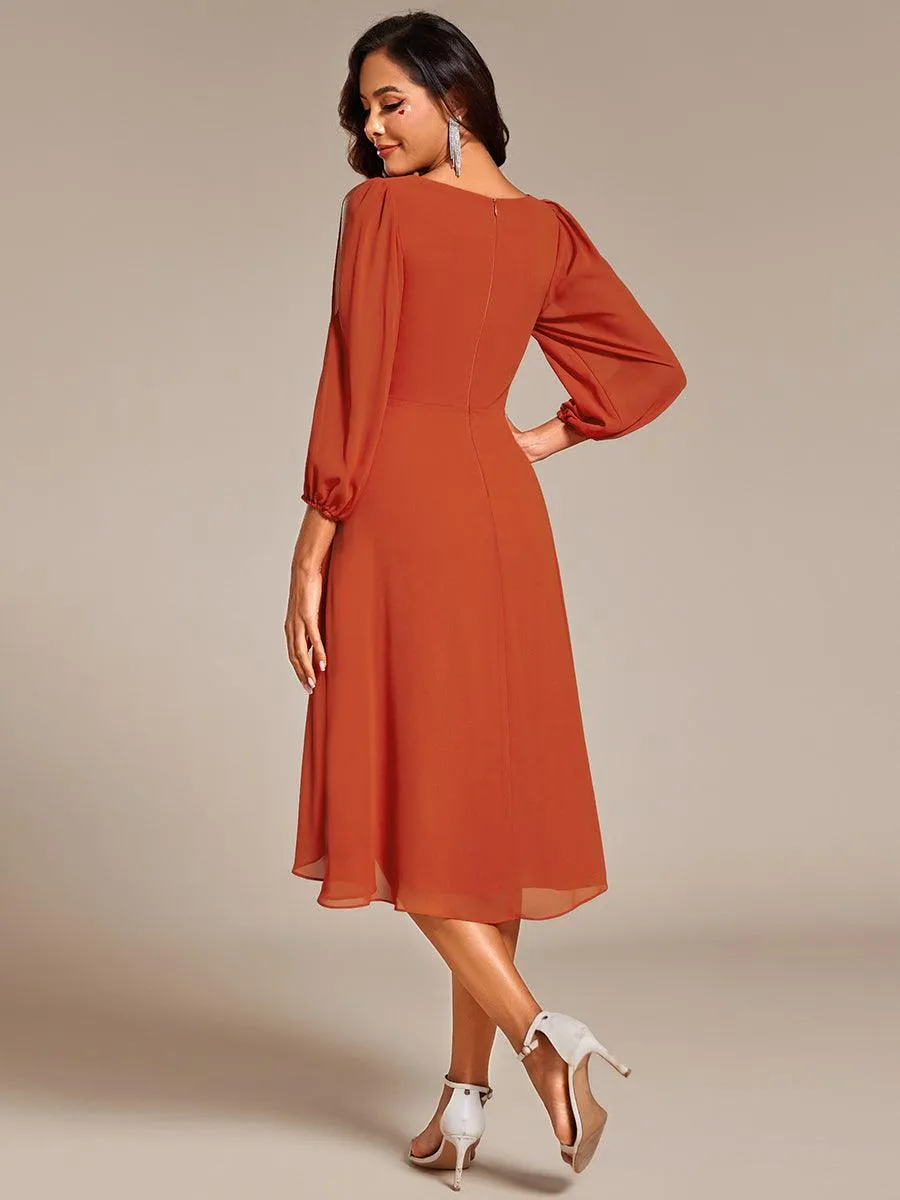 Robe d'invitée de mariage en mousseline de soie à manches longues et taille trapèze