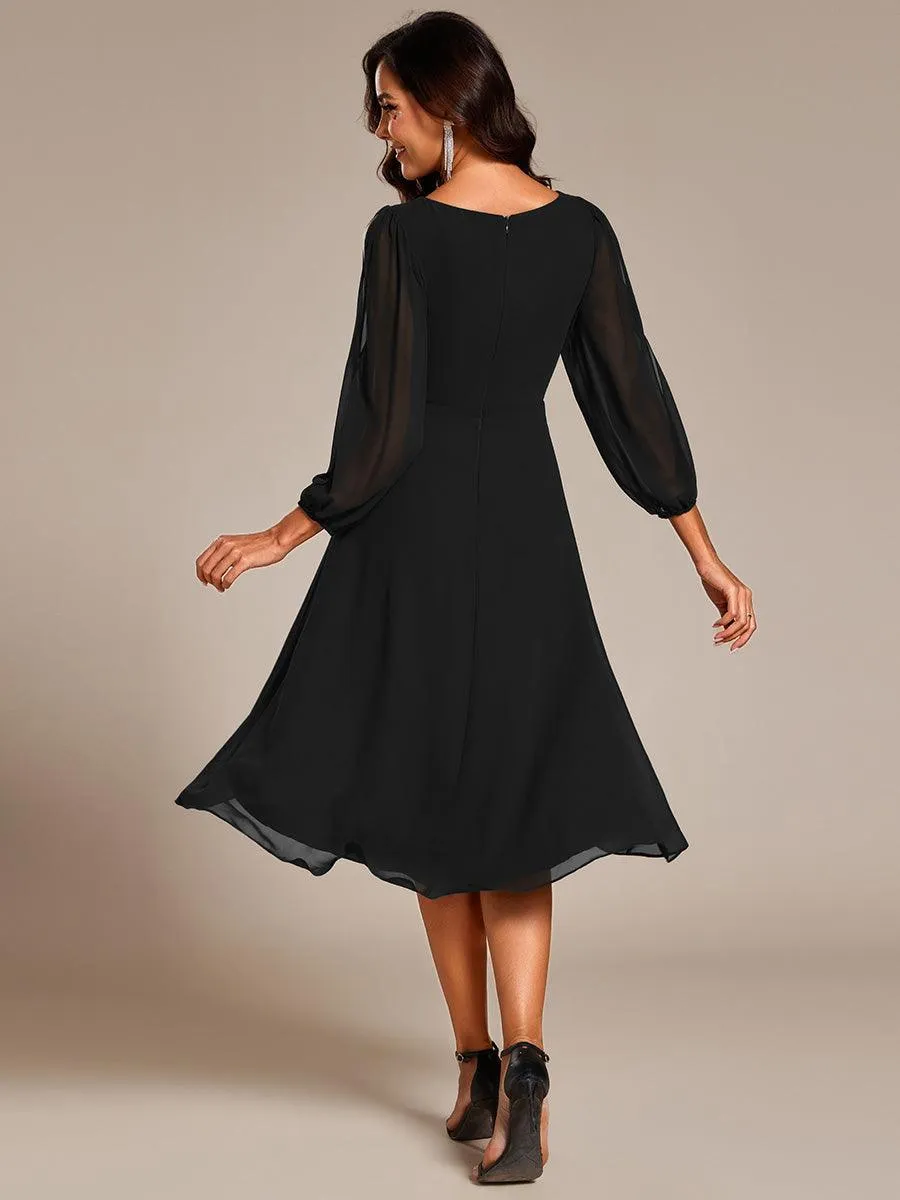 Robe d'invitée de mariage en mousseline de soie à manches longues et taille trapèze