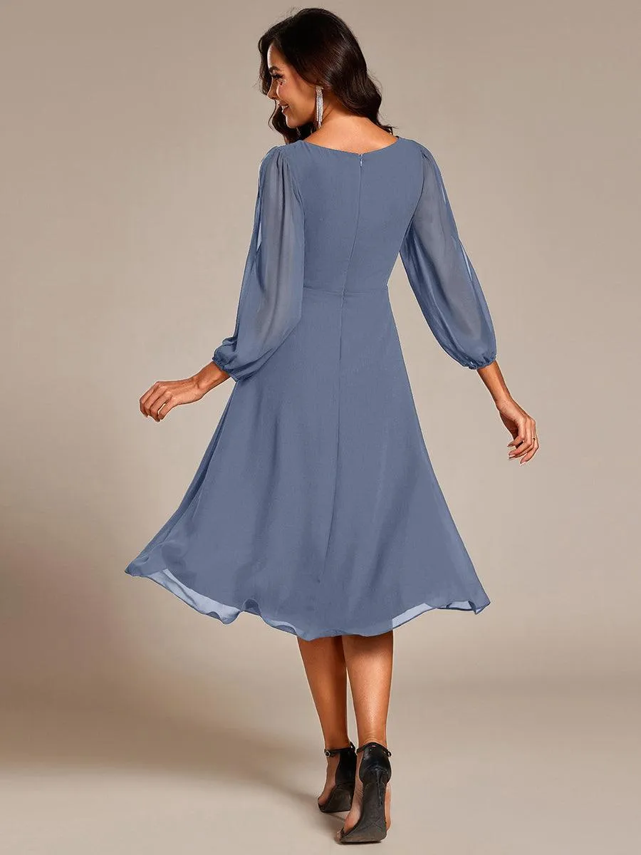 Robe d'invitée de mariage en mousseline de soie à manches longues et taille trapèze