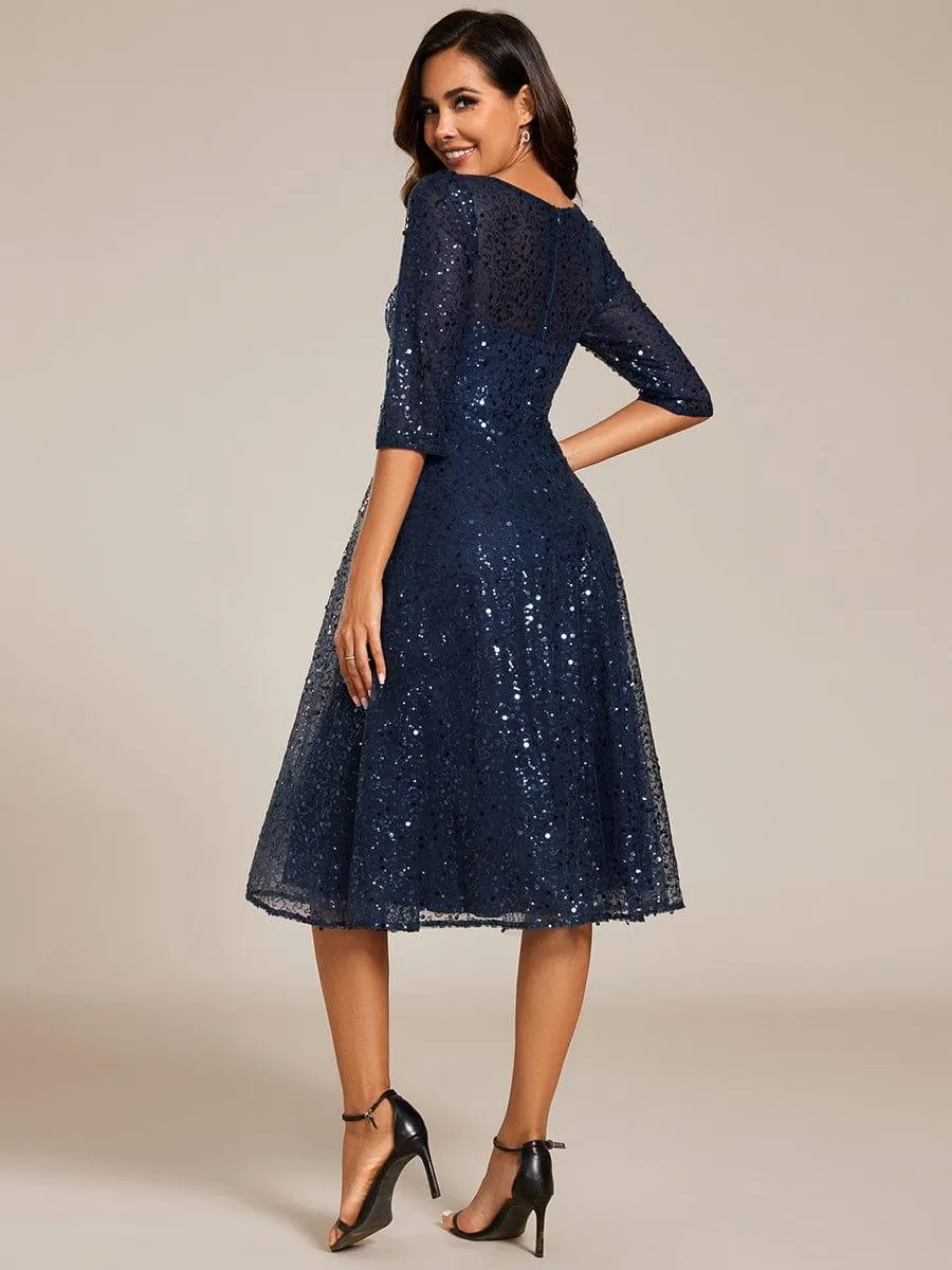 Robe d'invitée de mariage à manches 3/4 et col rond en sequins