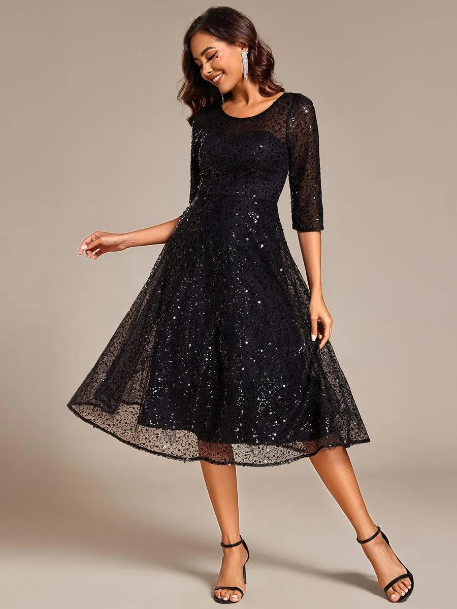 Robe d'invitée de mariage à manches 3/4 et col rond en sequins