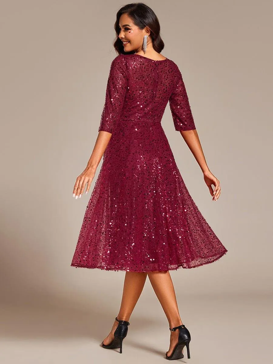Robe d'invitée de mariage à manches 3/4 et col rond en sequins