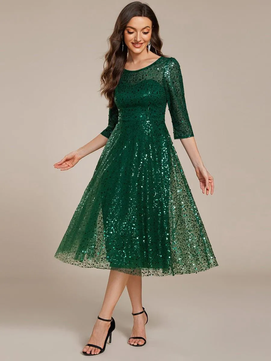 Robe d'invitée de mariage à manches 3/4 et col rond en sequins